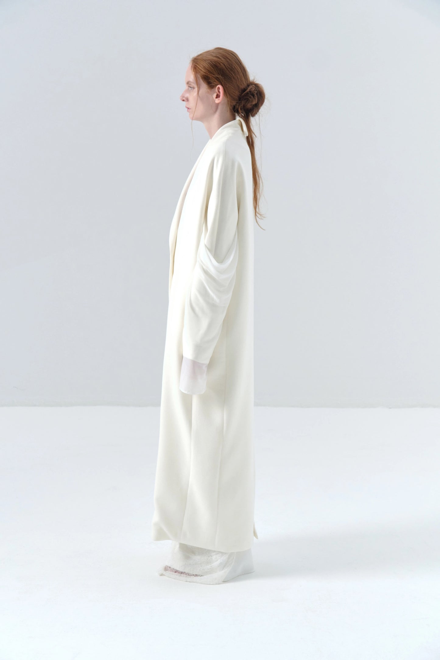 White Long Coat with Spliced Sleeves and Asymmetric Design