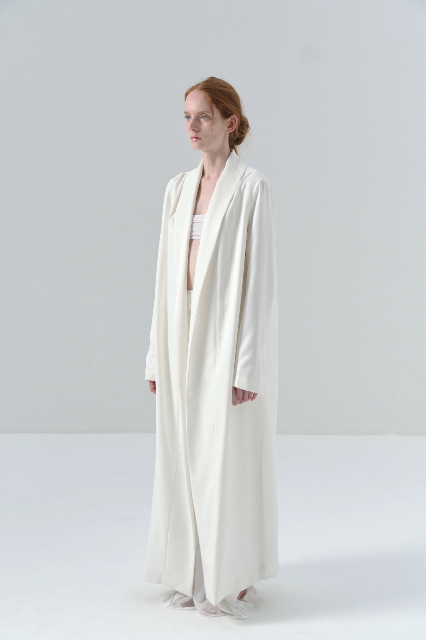 White Long Coat with Exposed Stitches in Cupro