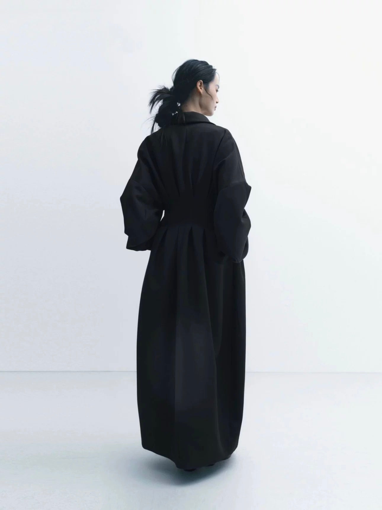 Coat with Three-Dimensional Tailoring and Waist Cinching