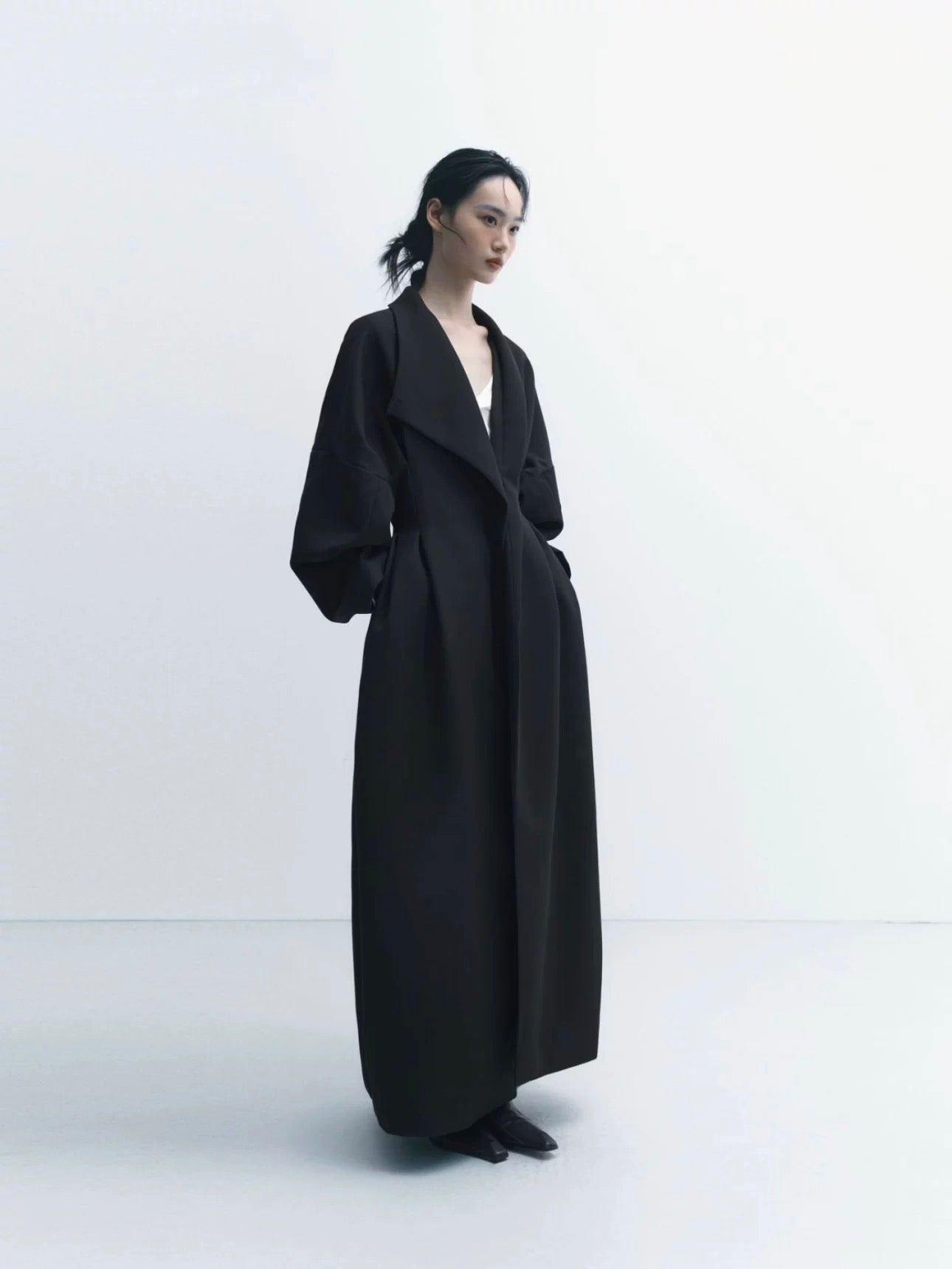Coat with Three-Dimensional Tailoring and Waist Cinching