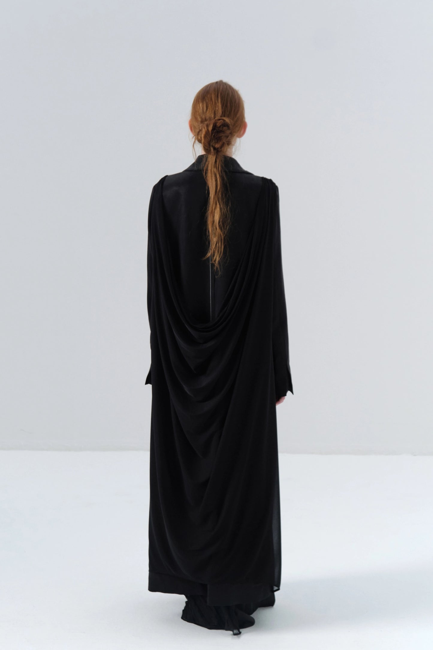 Black Long Coat with Exposed Stitches in Cupro