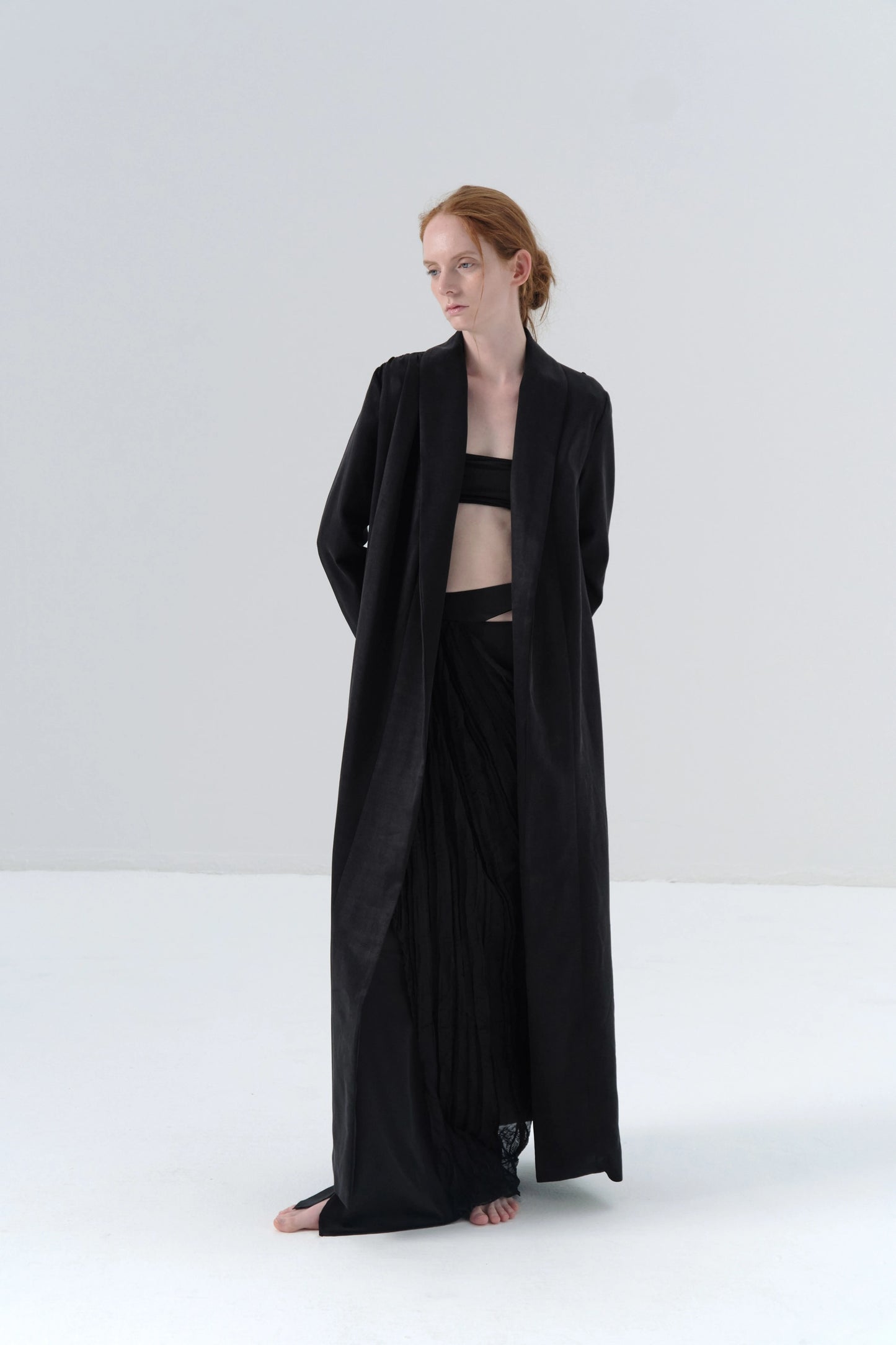 Black Long Coat with Exposed Stitches in Cupro
