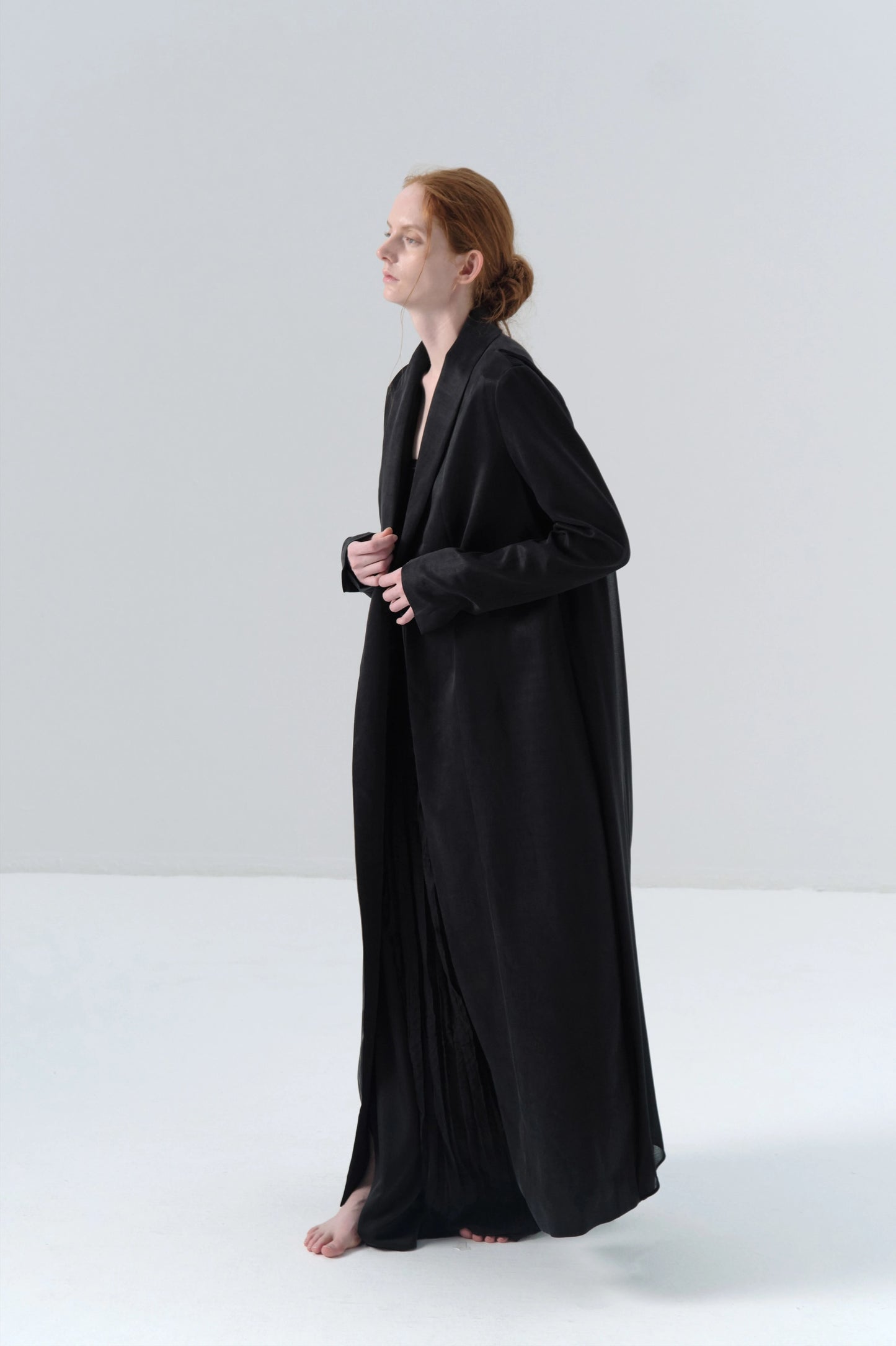 Black Long Coat with Exposed Stitches in Cupro