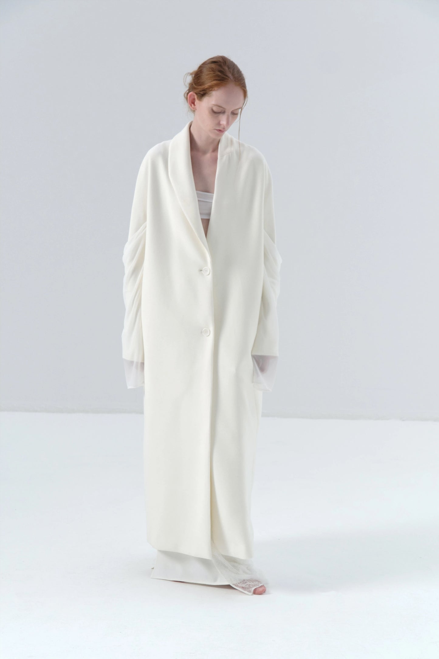 White Long Coat with Spliced Sleeves and Asymmetric Design