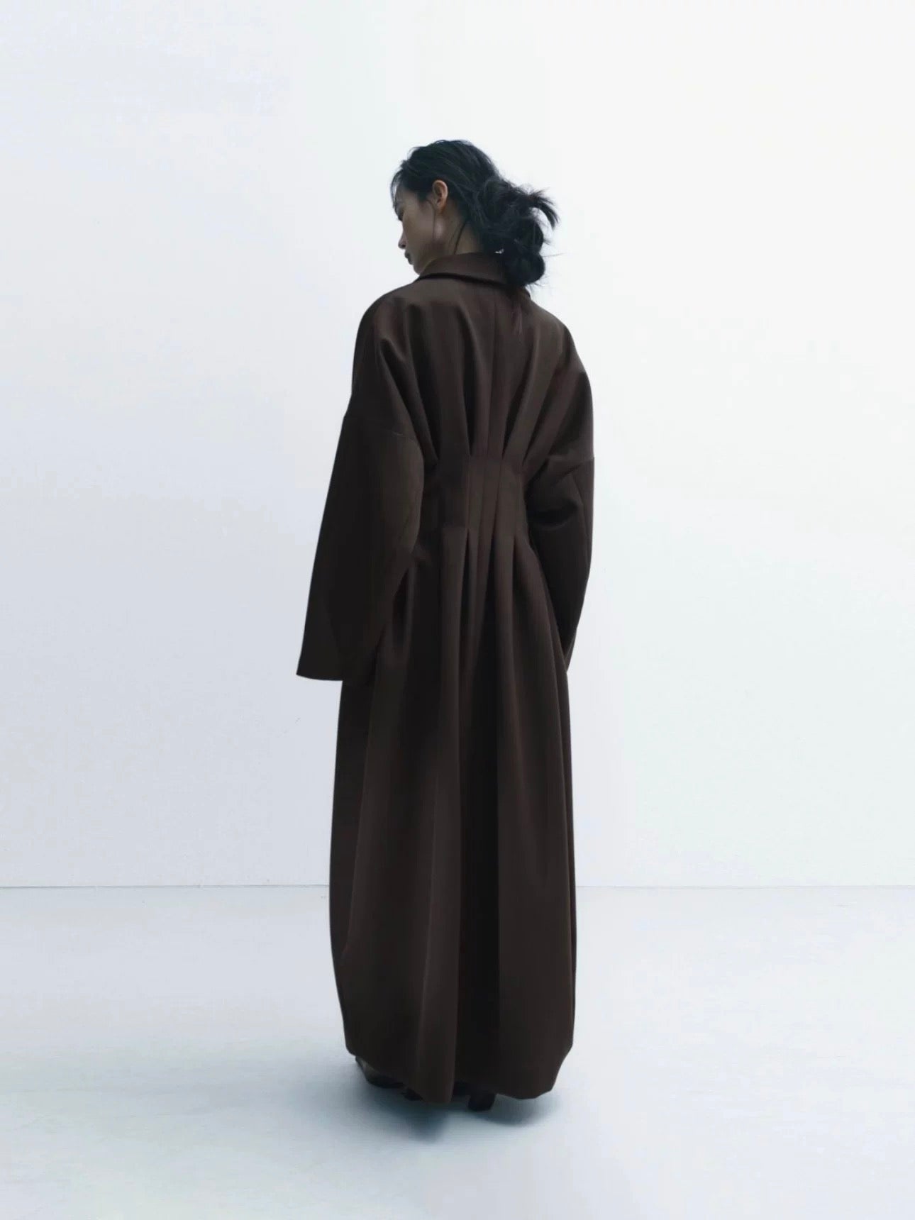 Coat with Three-Dimensional Tailoring and Waist Cinching