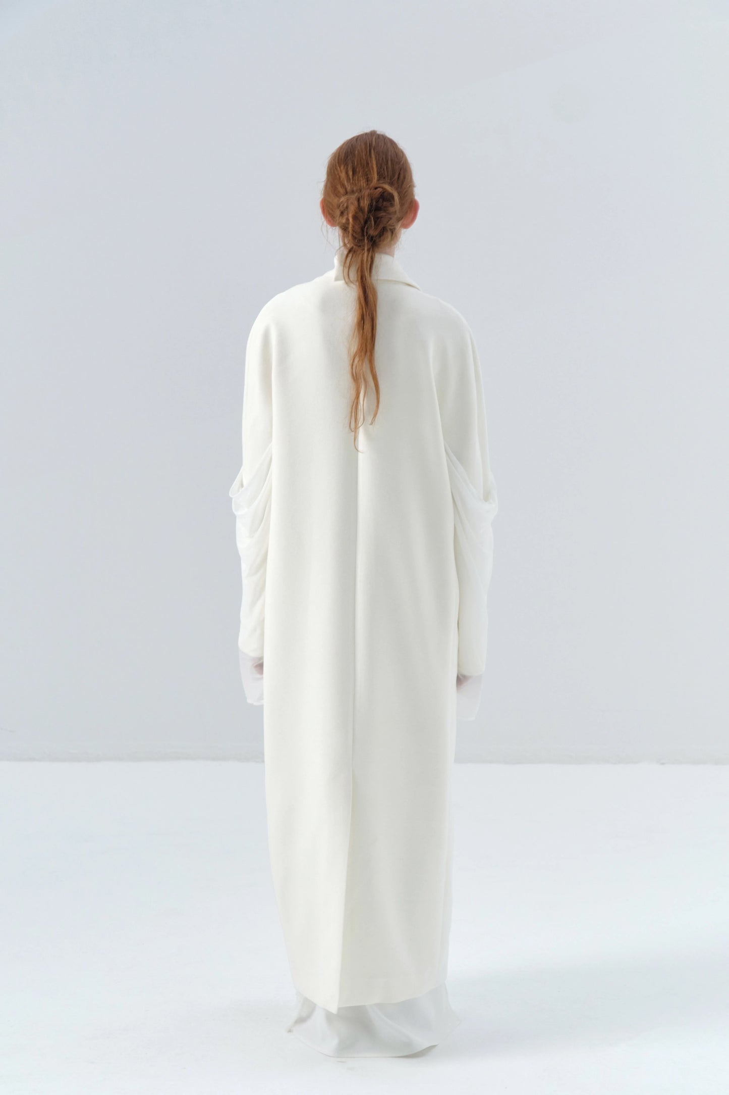 White Long Coat with Spliced Sleeves and Asymmetric Design