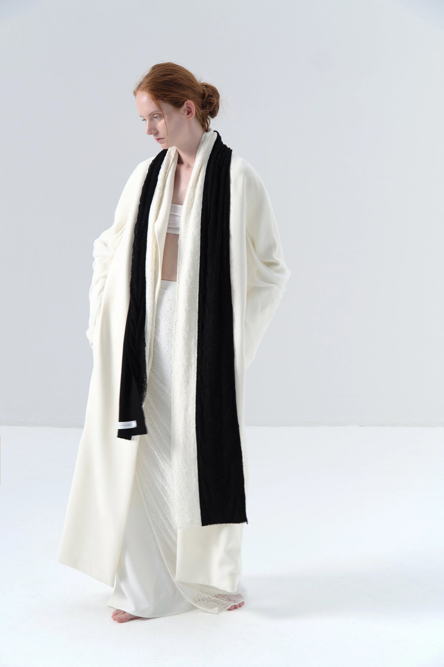 White Long Coat with Spliced Sleeves and Asymmetric Design