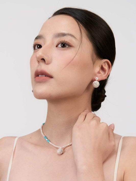 Dense-patterned pearl earrings